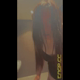Emi stands on a public toilet in a black top and twerks her bare ass for the camera as she poops, filmed from below the seat. Vertical format video. Over 11 minutes.